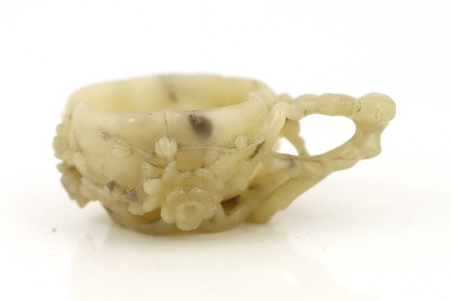 CORRECTION: A Chinese creamy white soapstone NOT jade ‘plum blossom’ cup, 18th/19th century